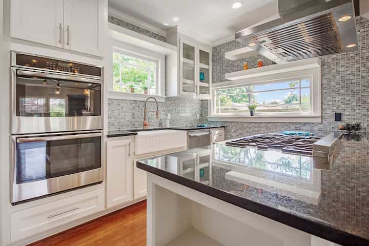 An image of a modern kitchen with sleek appliances, featuring a gas stove, refrigerator, and built-in microwave in Mount Prospect